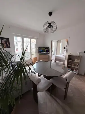 a living room with a table and a tv at Premium address for trade shows and conferences in Cannes 5min walk to Palais des Festivales in Cannes