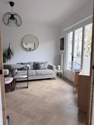 a dining room with a wooden table and a window at Premium address for trade shows and conferences in Cannes 5min walk to Palais des Festivales in Cannes