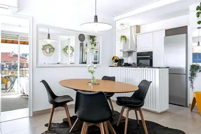 a kitchen and dining room with a table and chairs at Jardin d'Eden - Incroyable Rooftop Jardin suspendu in Cannes