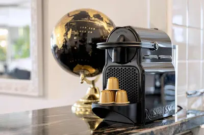 a coffee maker sitting on top of a counter at Jardin d'Eden - Incroyable Rooftop Jardin suspendu in Cannes