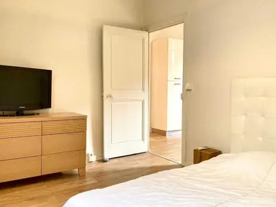 a bedroom with a bed and a television on a dresser at Appartement moderne - 1BR-4P- Cannes in Cannes