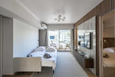 a bedroom with a bed and a large window at Apartment for 4people in Martinez in Cannes