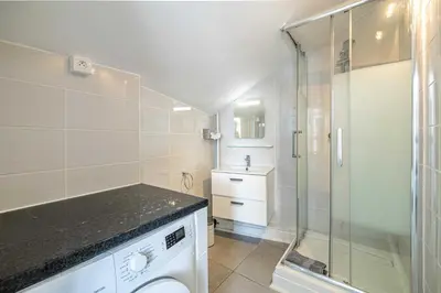 a bathroom with a toilet and a glass shower at Luxury Penthouse 120mÂ² in the heart of Cannes in Cannes