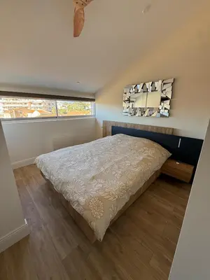 a bedroom with a bed and a window at Roof top Luxe Cannes in Cannes