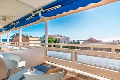 a balcony with a view of the ocean at Marius By Terrys Homes in Cannes