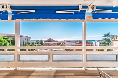 a view from the balcony of a house with large windows at Marius By Terrys Homes in Cannes