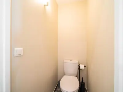 a bathroom with a white toilet in a stall at Quiet and luxurious apartment - Cannes Center - 2BR 6p in Cannes