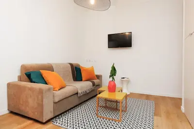 a living room with a couch and a table at Immogroom - 1 Bedroom - City Center - AC in Cannes
