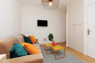 a living room with a couch and a table at Immogroom - 1 Bedroom - City Center - AC in Cannes
