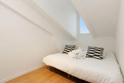 a room with two beds in a attic at Immogroom - 1 Bedroom - City Center - AC in Cannes