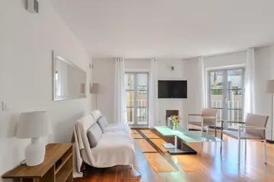a living room with a couch and a table at Rue d Antibes 2ch, 2 SDB, clim, balcon in Cannes