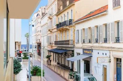 an empty street in a city with buildings at Immogroom – Stylish Studio – Beach 1 min away- AC in Cannes