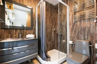 a bathroom with a shower and a toilet and a sink at Immogroom – Stylish Studio – Beach 1 min away- AC in Cannes