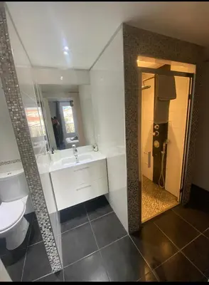a bathroom with a sink and a toilet and a mirror at Smart 3Apart- Cannes Le 62 in Cannes