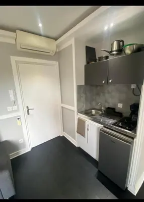 a small kitchen with a sink and a stove at Smart 3Apart- Cannes Le 62 in Cannes