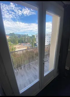 a window with a view of a balcony at Smart 3Apart- Cannes Le 62 in Cannes