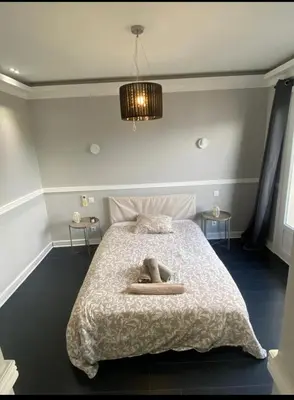 a bedroom with a bed with a person laying on it at Smart 3Apart- Cannes Le 62 in Cannes