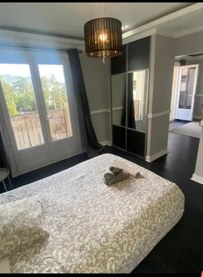 a bedroom with a large bed and a large window at Smart 3Apart- Cannes Le 62 in Cannes