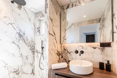 a bathroom with a sink and a shower at Terrasse Vue Mer - 2BR - Parking - Croisette 50m in Cannes