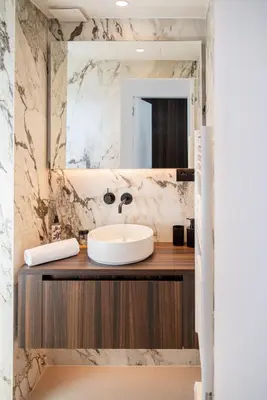a bathroom with a sink and a mirror at Terrasse Vue Mer - 2BR - Parking - Croisette 50m in Cannes