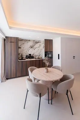 a dining room with a table and chairs at Terrasse Vue Mer - 2BR - Parking - Croisette 50m in Cannes