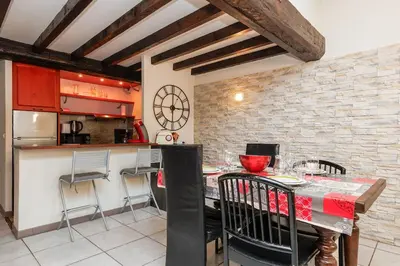 a kitchen and dining room with a table and chairs at Immogroom - 2 Bedroom - Close to citycenter in Cannes