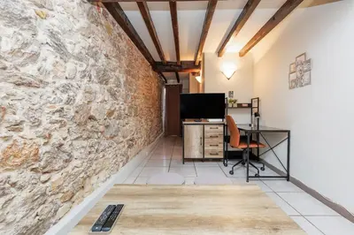 an office with a stone wall and a desk at Immogroom - 2 Bedroom - Close to citycenter in Cannes
