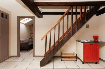 a hallway with a staircase with a red cabinet at Immogroom - 2 Bedroom - Close to citycenter in Cannes