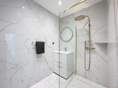 a white bathroom with a shower and a sink at Rue d'Antibes Victoria 2 rooms terrace - 2ES in Cannes