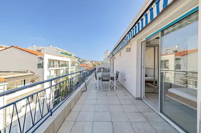a balcony with a view of a building at 6 LECERF T5 - Apartment heart of Cannes 4 Bedrooms Terrace in Cannes