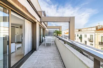 a balcony with a view of a building at 64 ANTIBES - Stunning 1-bedroom with terrace at Gray d'Albion in Cannes