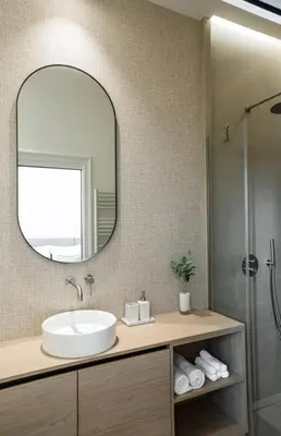 a bathroom with a sink and a mirror at 106 ANTIBES - Luxurious 4-bedroom apartment Rue d'Antibes in Cannes