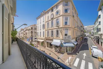 a view from a balcony of a street with buildings at 106 ANTIBES - Luxurious 4-bedroom apartment Rue d'Antibes in Cannes