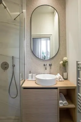 a bathroom with a sink and a mirror at 106 ANTIBES - Luxurious 4-bedroom apartment Rue d'Antibes in Cannes