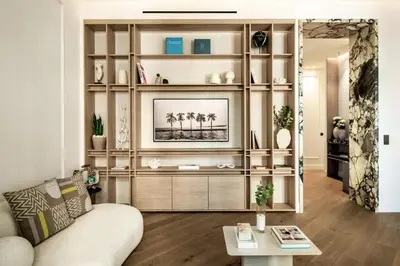 a living room with a couch and a entertainment center at 106 ANTIBES - Luxurious 4-bedroom apartment Rue d'Antibes in Cannes