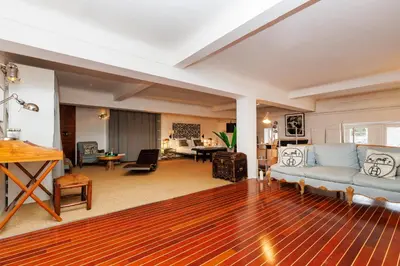 a living room with a couch and a table at Loft Gallia YourHostHelper in Cannes
