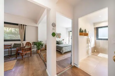 a living room with a bed and a dining room at COZYSTAY 1827 - Beautiful 3-room apartment with large private terrace in Cannes