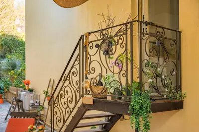 a staircase with plants on the side of a building at COZYSTAY 1827 - Beautiful 3-room apartment with large private terrace in Cannes