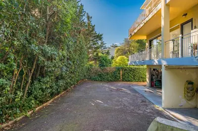 an empty parking lot in front of a building at COZYSTAY 1827 - Beautiful 3-room apartment with large private terrace in Cannes