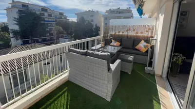 a balcony with a couch and a table at Chez Marilyne & Jean Baptise in Cannes