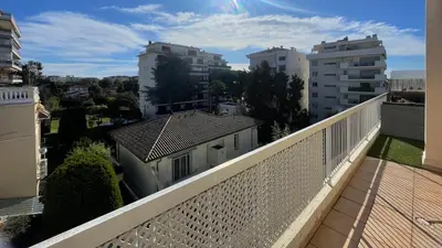 a balcony with a white fence and buildings at Chez Marilyne & Jean Baptise in Cannes