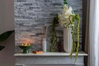 a table with vases and candles and flowers on it at Studio design au centre de Cannes proche Croisette climatisé in Cannes