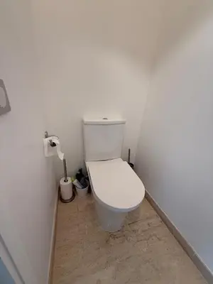 a bathroom with a white toilet in a room at Spacious 2-bedroom sea view with parking in Palm Beach in Cannes