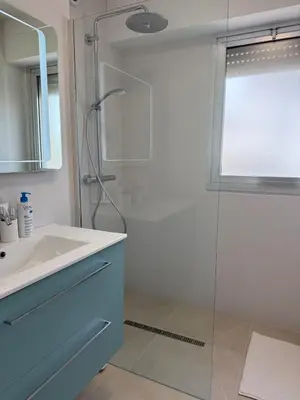 a bathroom with a sink and a shower at Spacious 2-bedroom sea view with parking in Palm Beach in Cannes