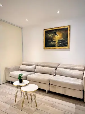 a living room with a couch and two tables at Luxury Cannes Suite Terrace Walk to Palais in Cannes