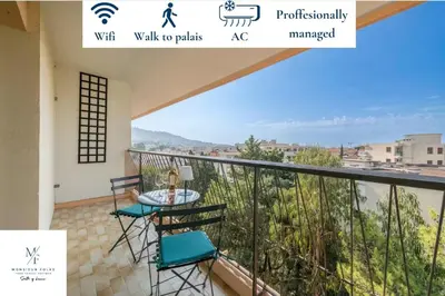 a balcony with a view of the ocean at Two bed - Walk to the beach in Cannes
