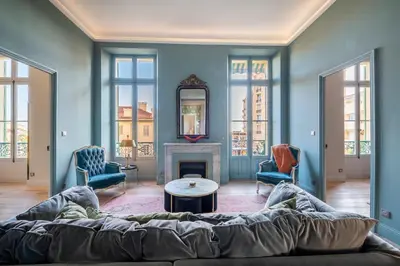 a living room with a couch and a fireplace at Luxury apartment in Cannes in Cannes
