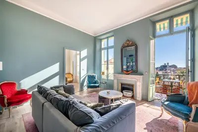 a living room with a couch and a fireplace at Luxury apartment in Cannes in Cannes