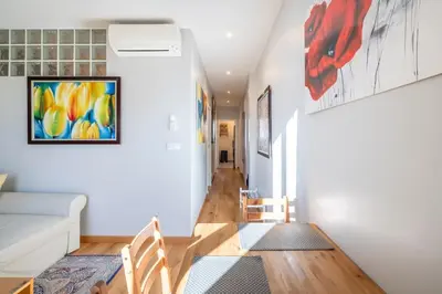a living room with a couch and a table at Two Bedrooms - 250m to the beach in Cannes