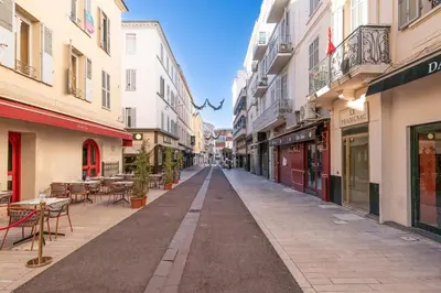 an empty street in a city with buildings at Two Bedrooms - 250m to the beach in Cannes